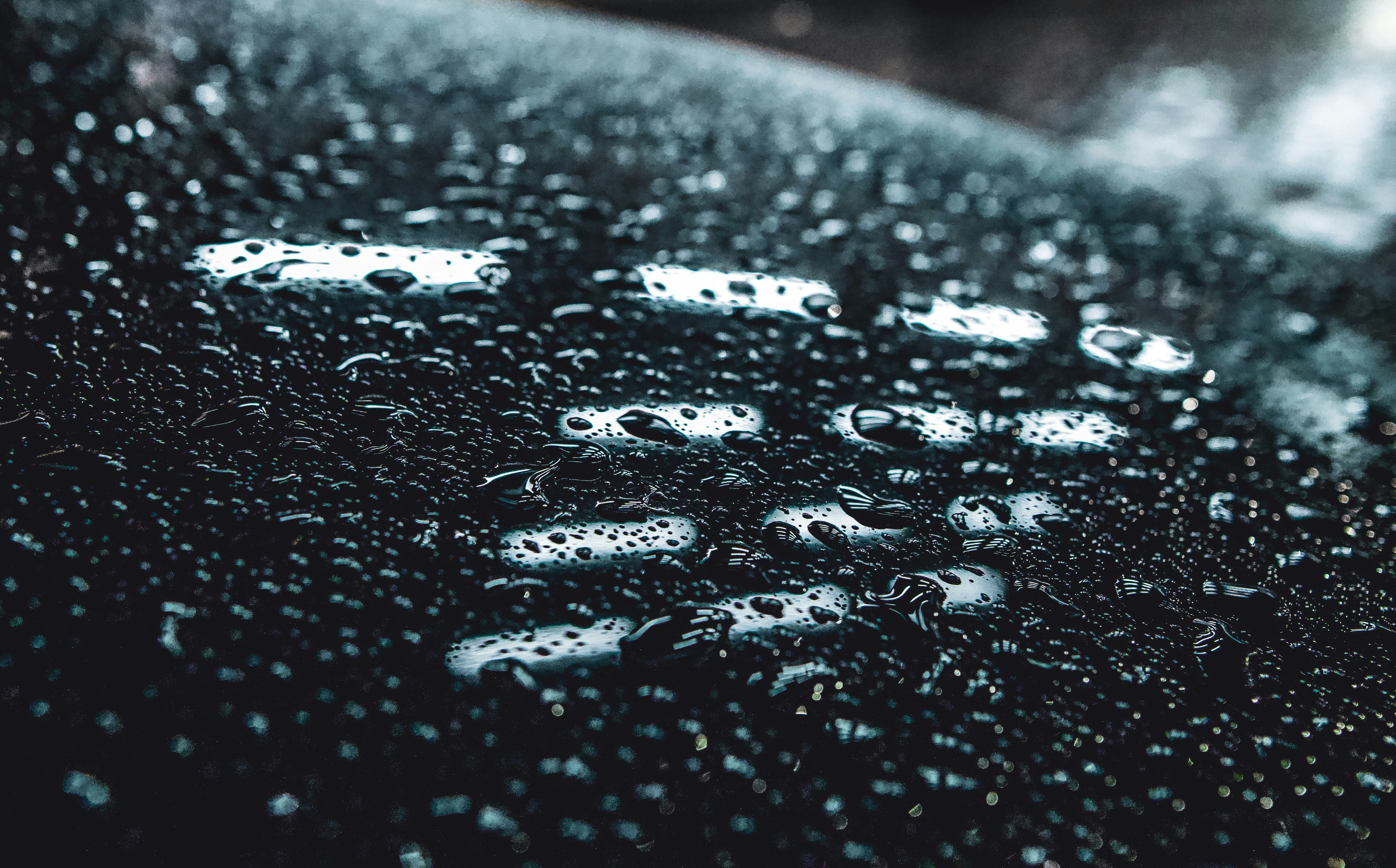 water droplets on black surface